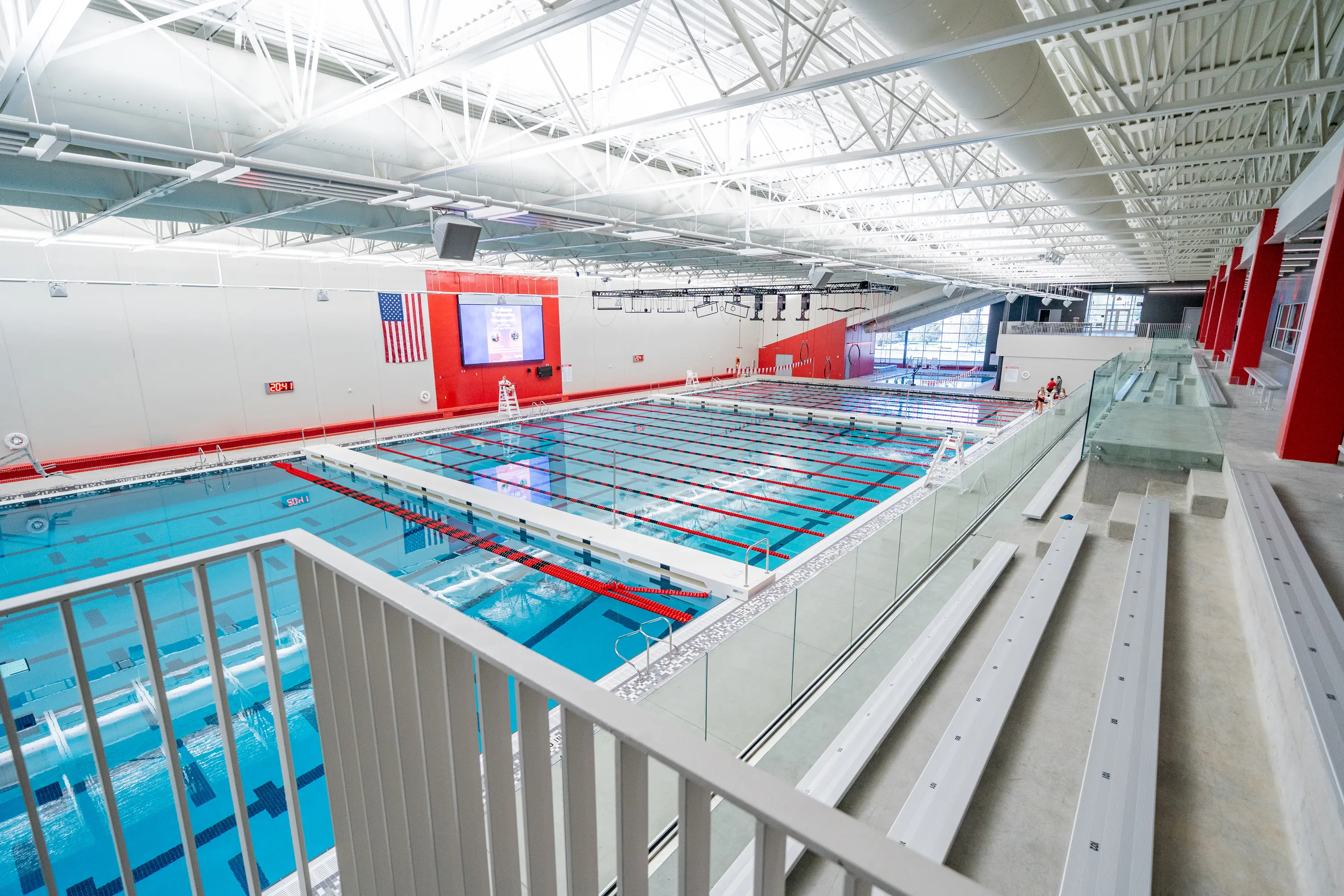 Usd Natatorium Wellness Center 09558 Overhead shot showing upper seating area and pool deck during final construction phase.