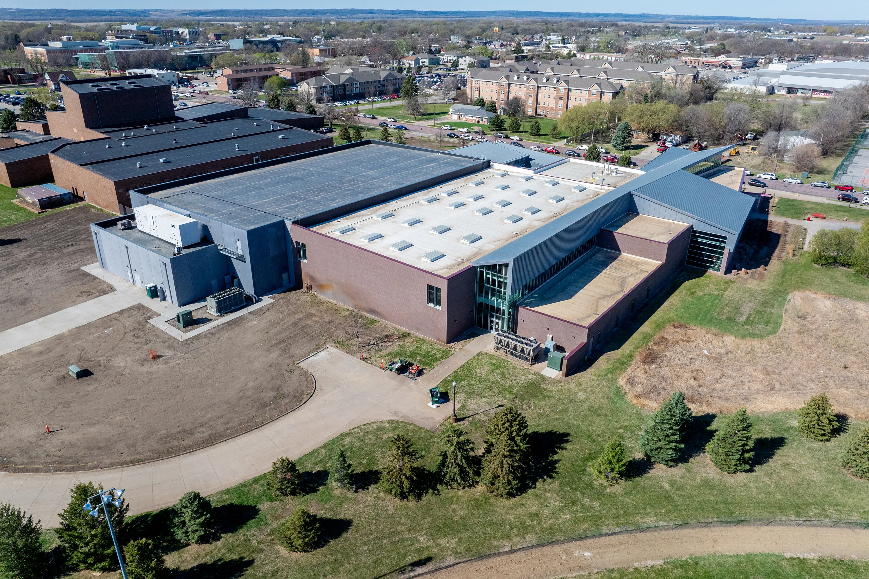 Usd Natatorium Wellness Center 12 Top-down view showing rooflines and layout of the natatorium and adjacent buildings.