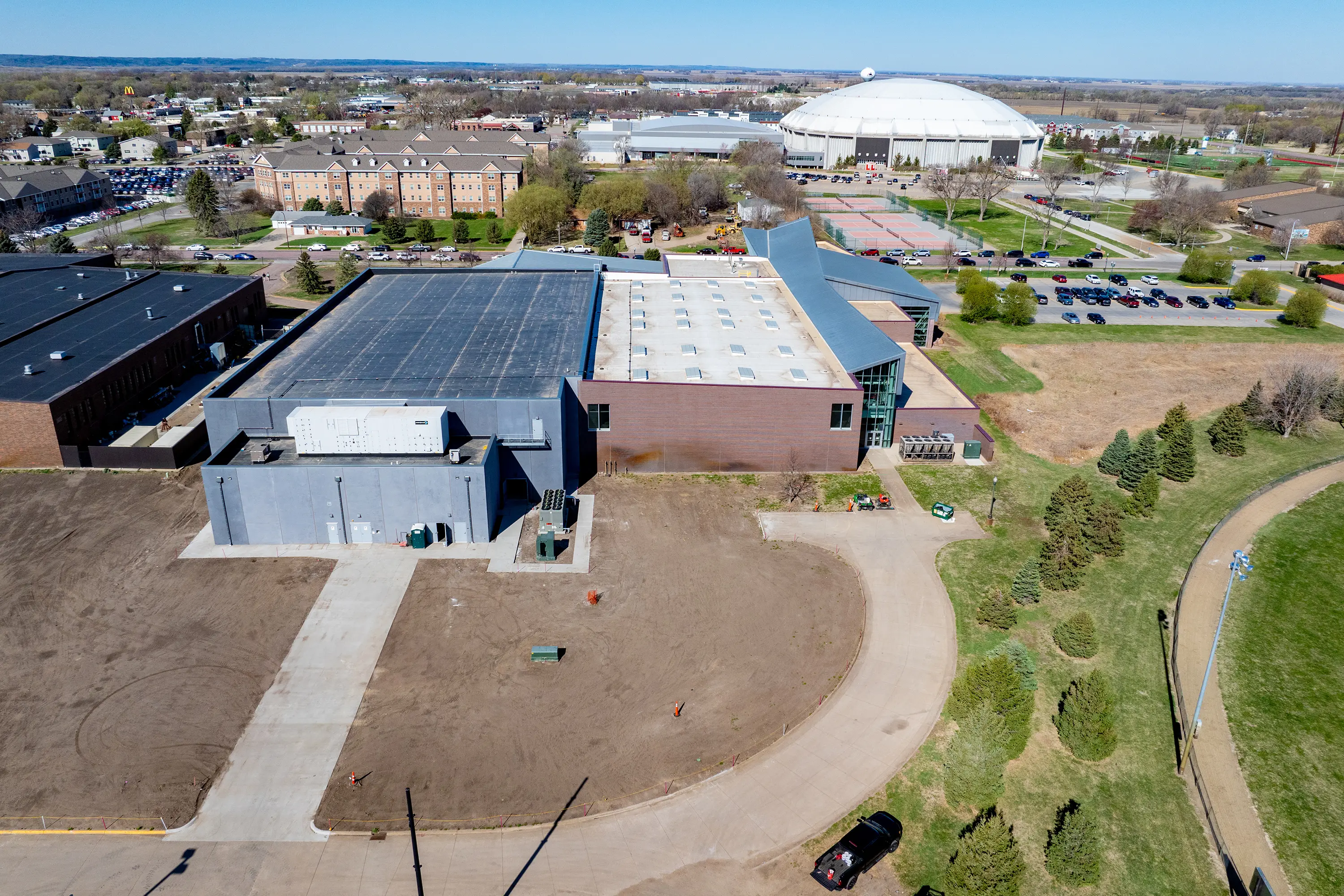 Usd Natatorium Wellness Center 13 Aerial photo featuring the entire USD campus with dome and new natatorium addition.