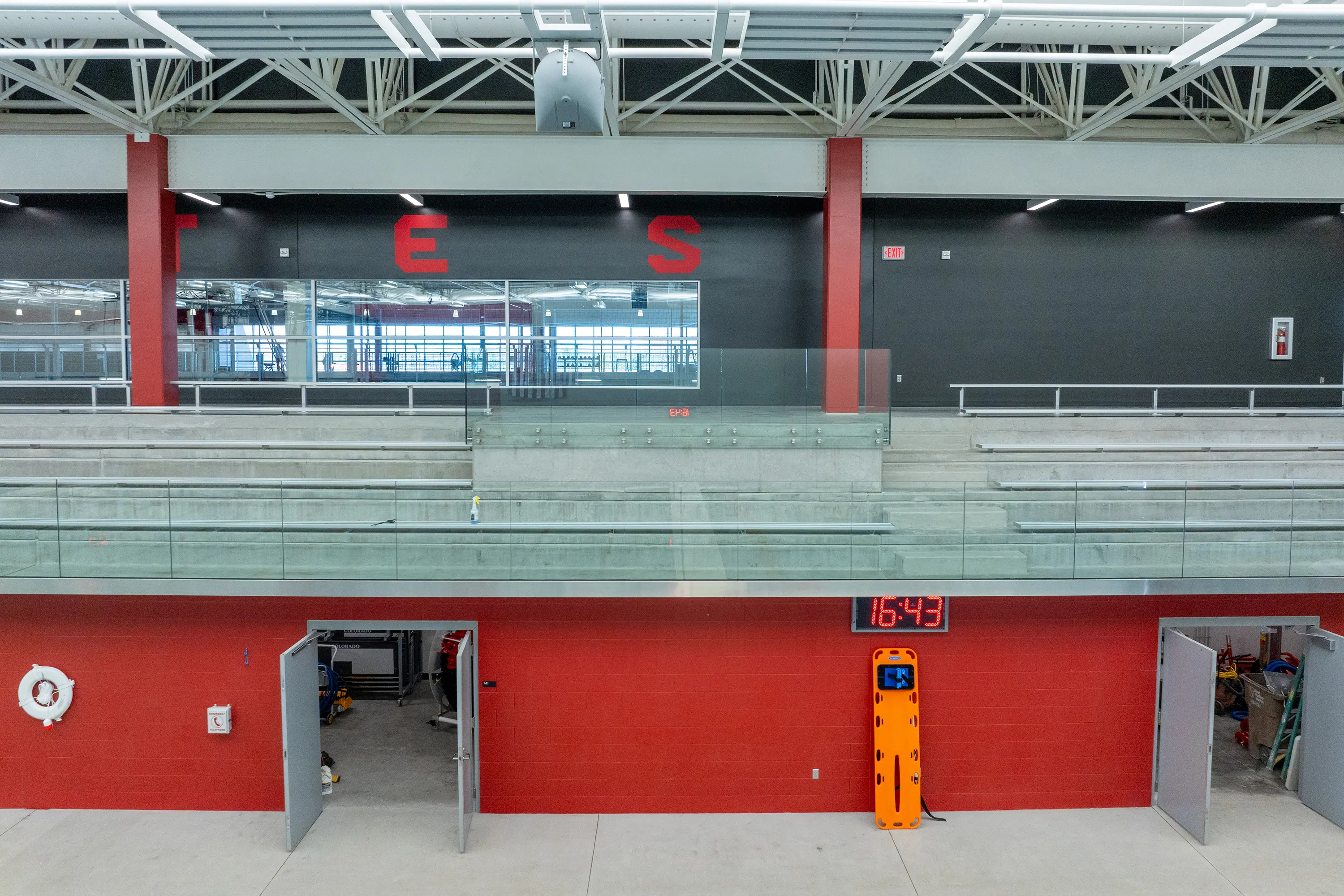 Usd Natatorium Wellness Center 34 Close-up of entry corridor below seating with visible precast risers and mechanical access.