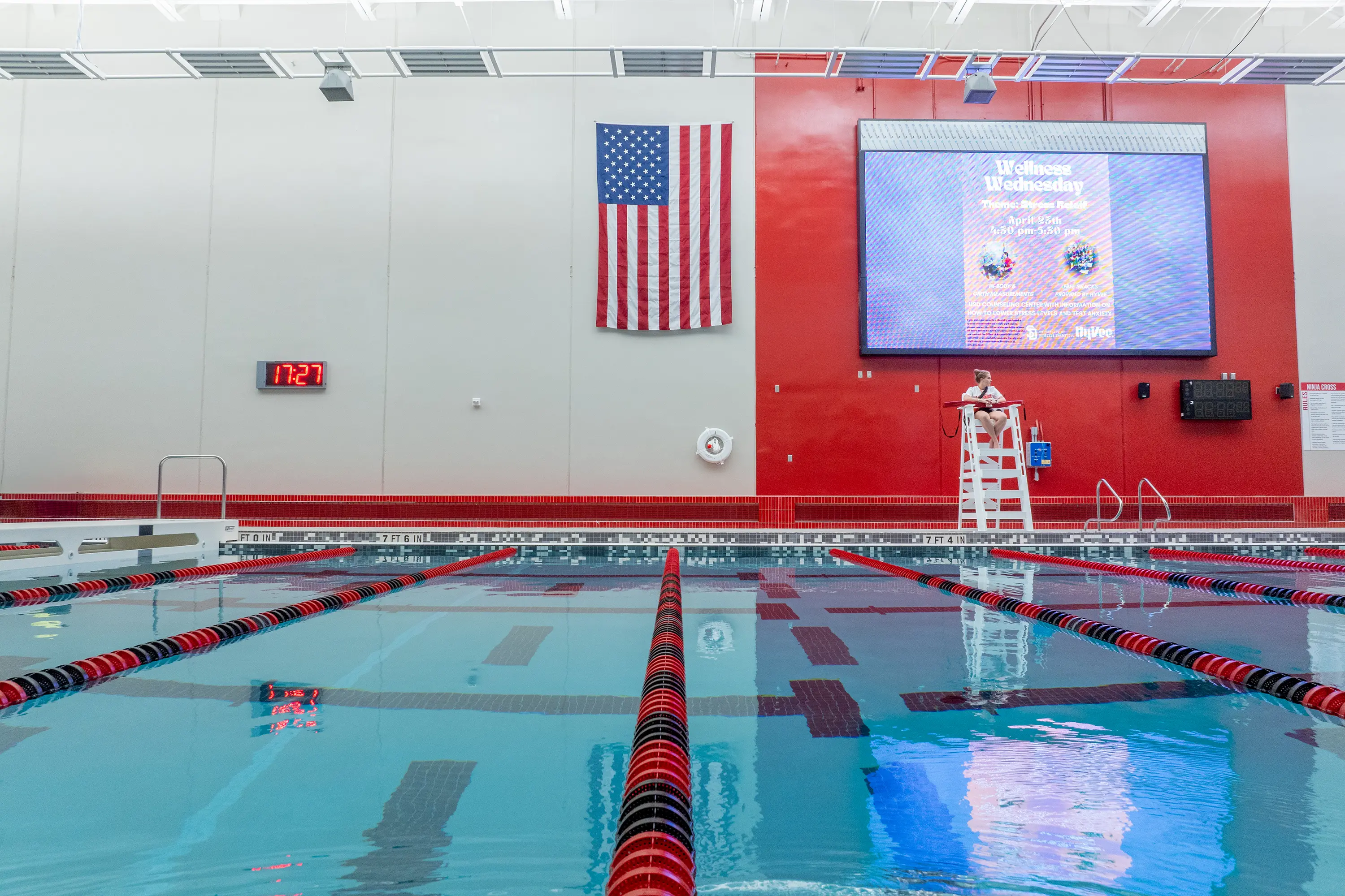 Usd Natatorium Wellness Center 35 Poolside view of diving platform area beneath USA flag