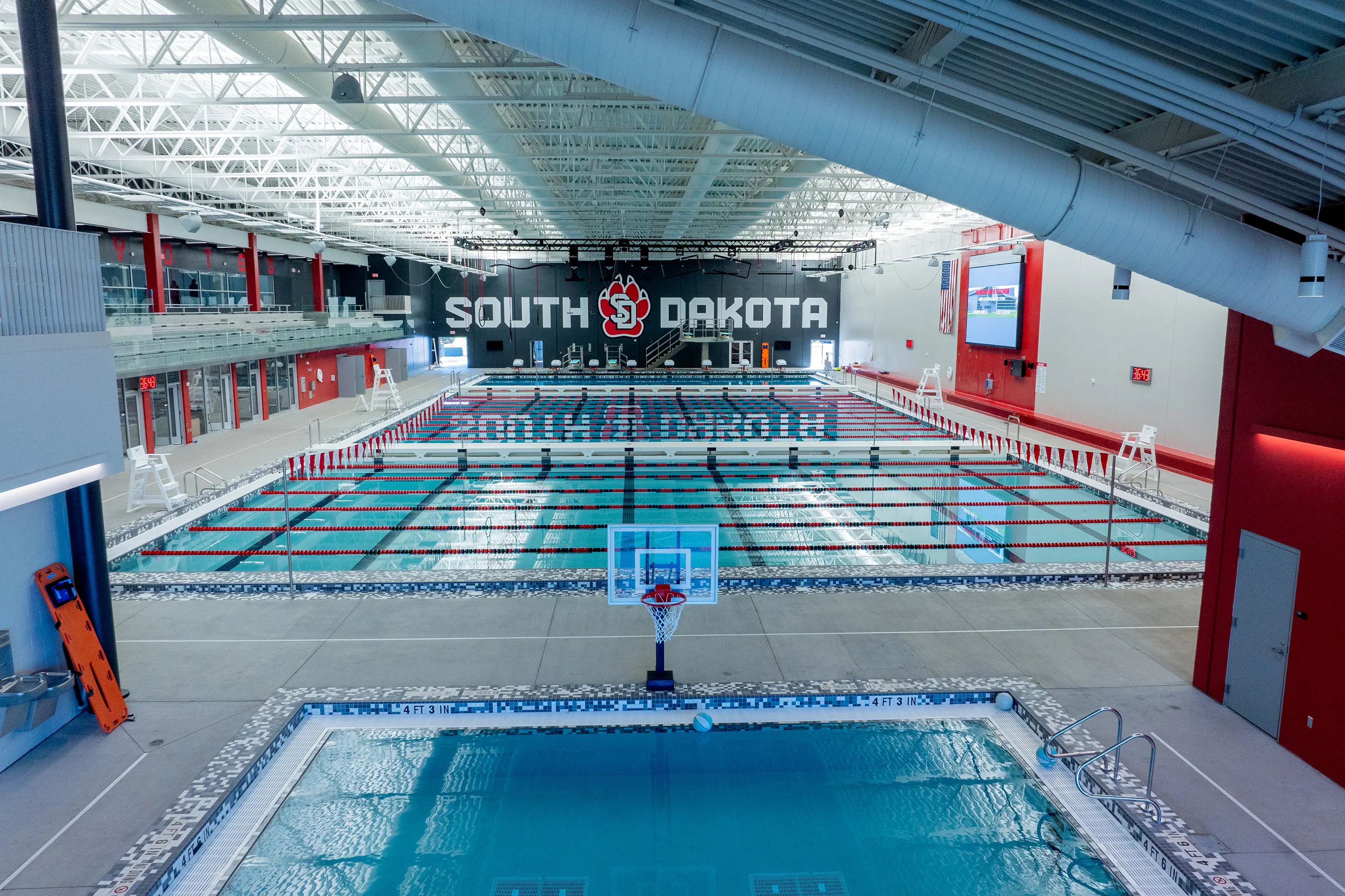 Usd Natatorium Finals 17 Centered pool view with all swim lanes visible, highlighting symmetry and lighting.