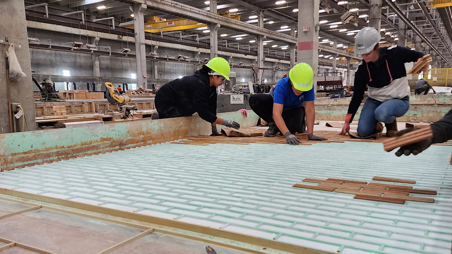 Women in Construction WIC laying thin brick in Gage Brothers' precast manufacturing facility in Sioux Falls SD