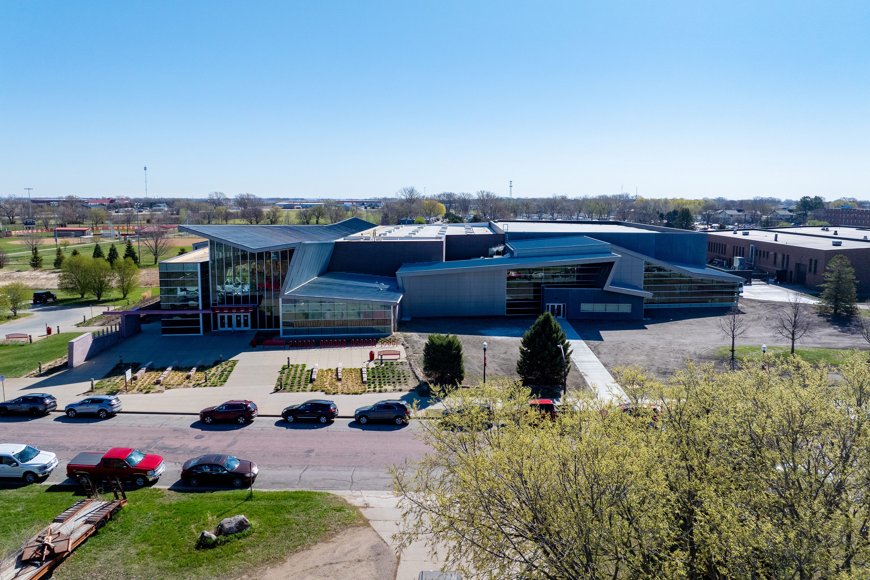Wide-angle overhead shot of the natatorium addition nestled within the university campus.